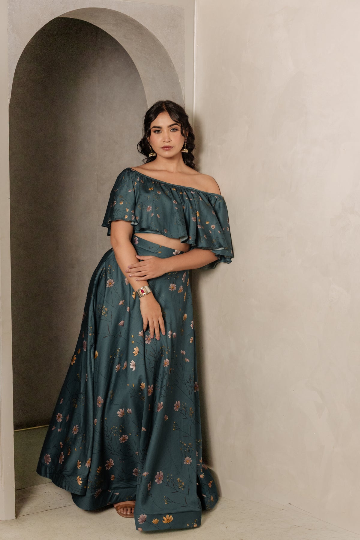Sthira Iris skirt in vegan silk with botanical print, worn with the teal ruffle blouse