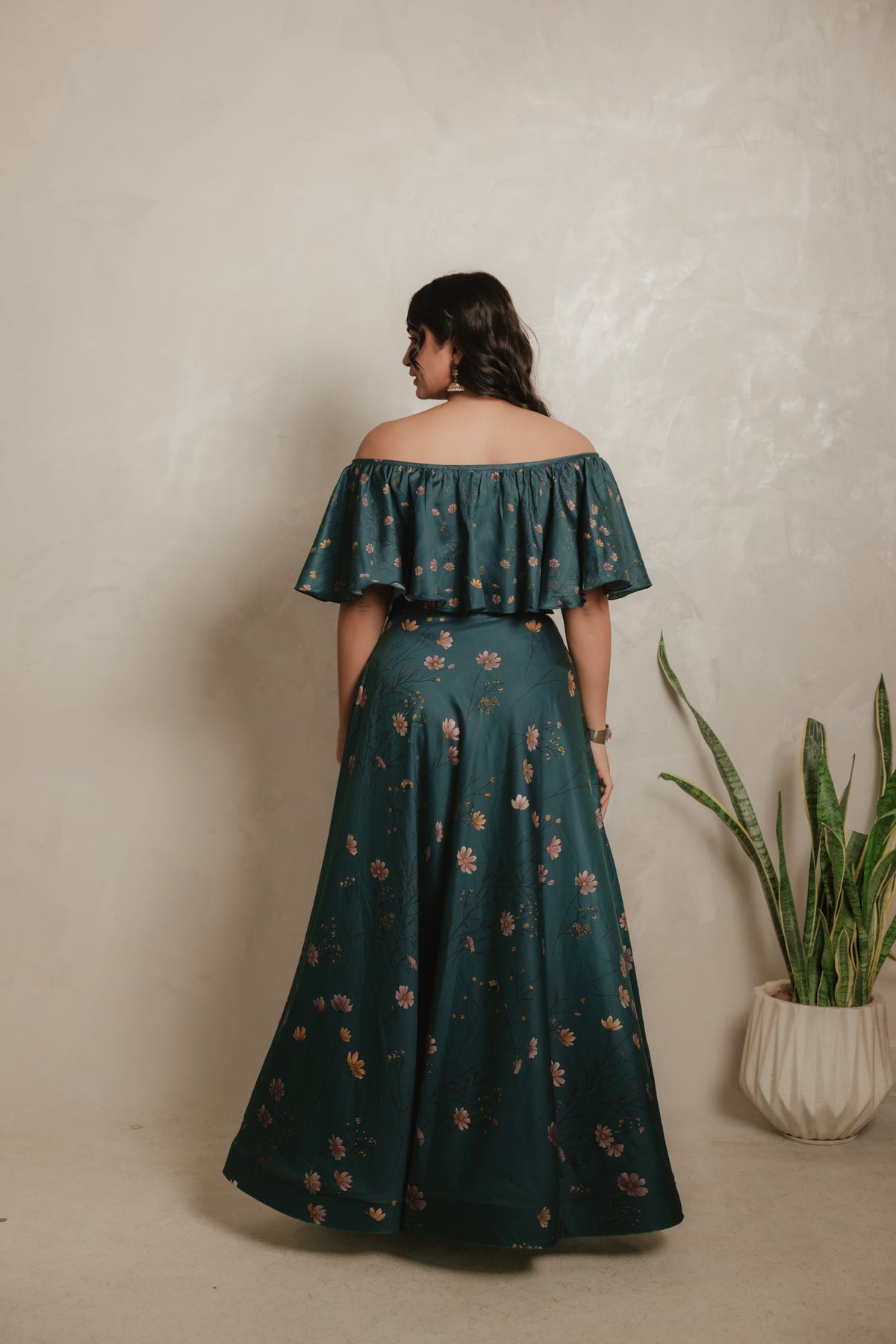 Sthira Iris skirt in vegan silk with botanical print, worn with the teal ruffle blouse