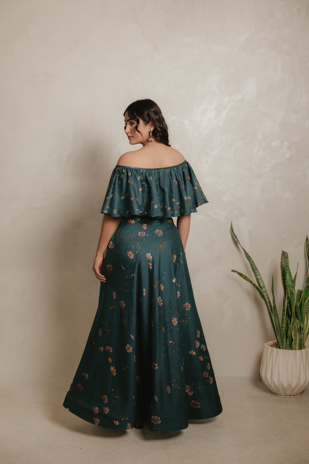 Sthira Iris skirt in vegan silk with botanical print, worn with the teal ruffle blouse