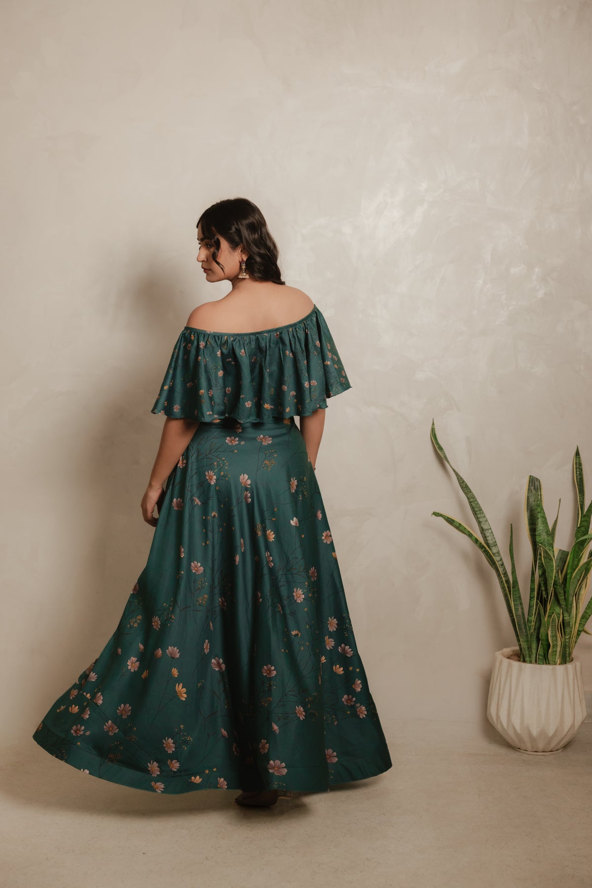 Sthira Iris skirt in vegan silk with botanical print, worn with the teal ruffle blouse