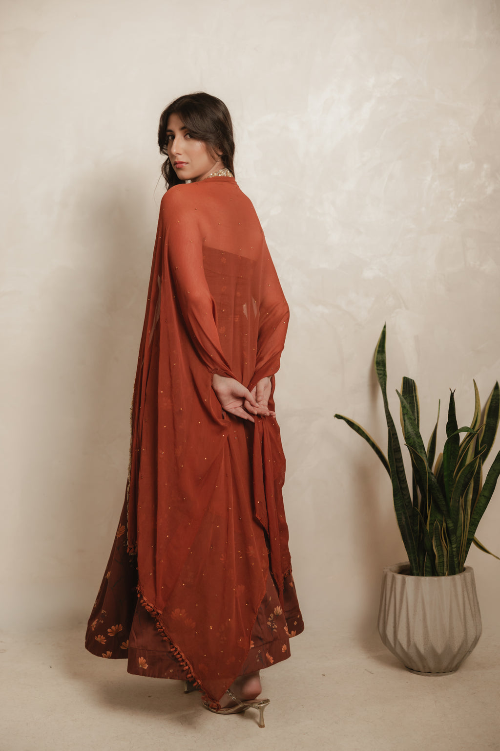 Sthira Calendula co-ord set in vegan silk, rust-brown botanical print, cape dupatta, back view