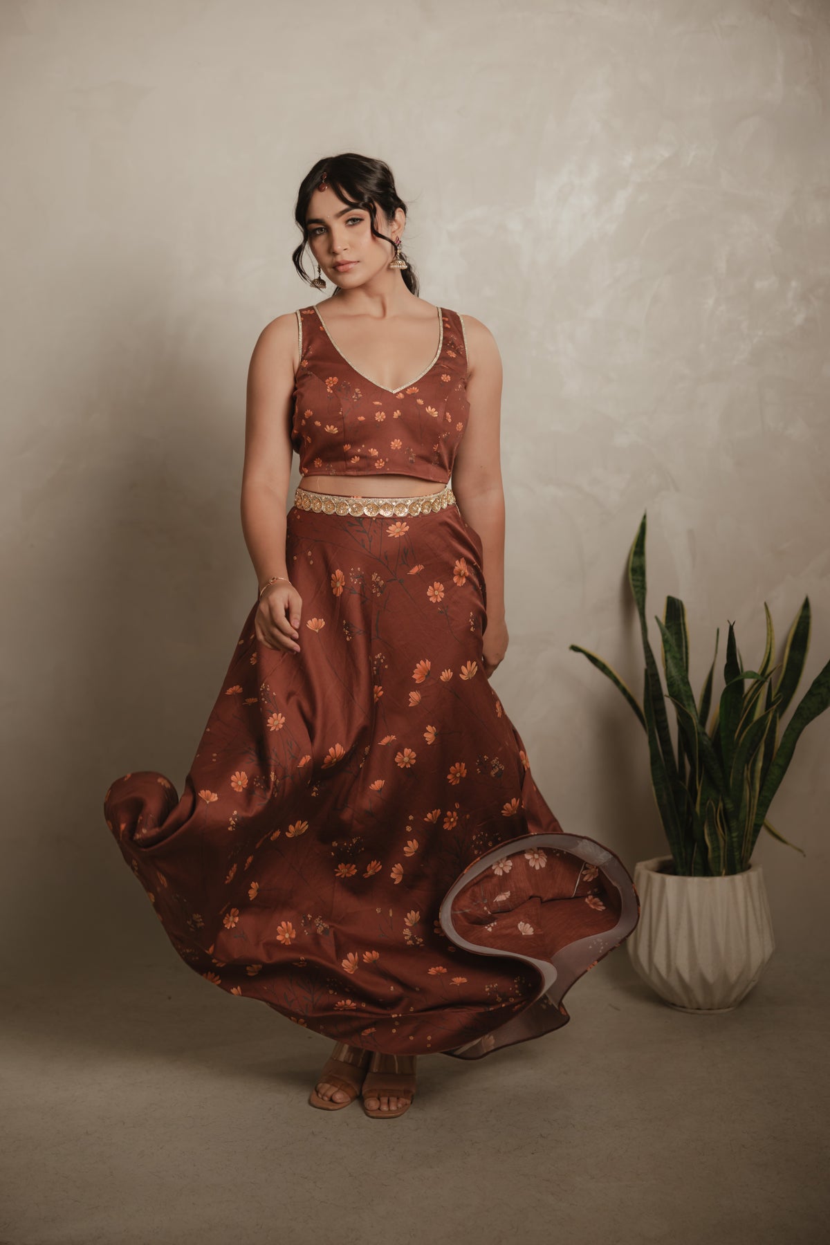 Sthira Celosia co-ord set in vegan silk, rust-brown botanical print, front view, in movement