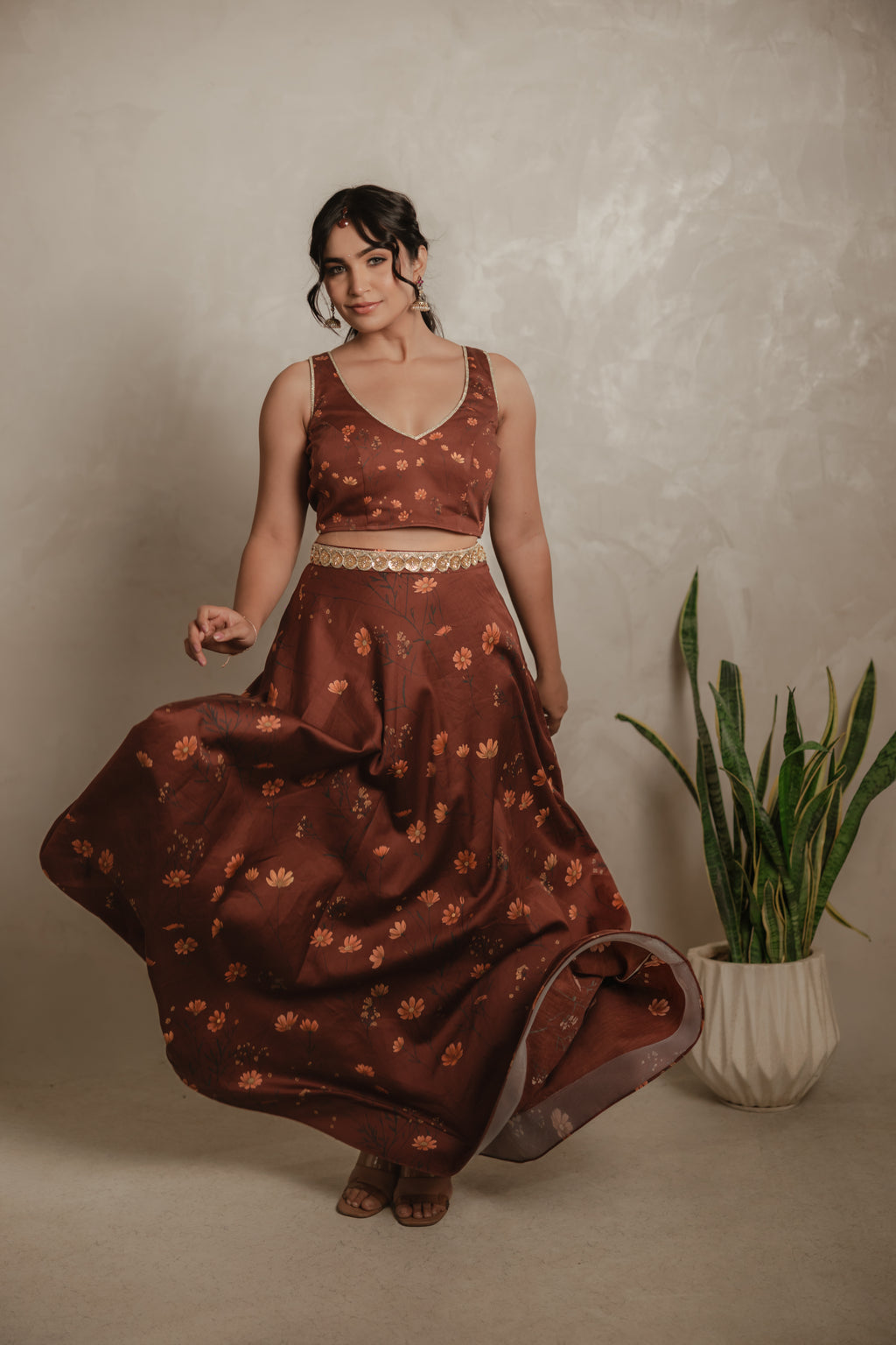 Sthira Celosia co-ord set in vegan silk, rust-brown botanical print, skirt in movement
