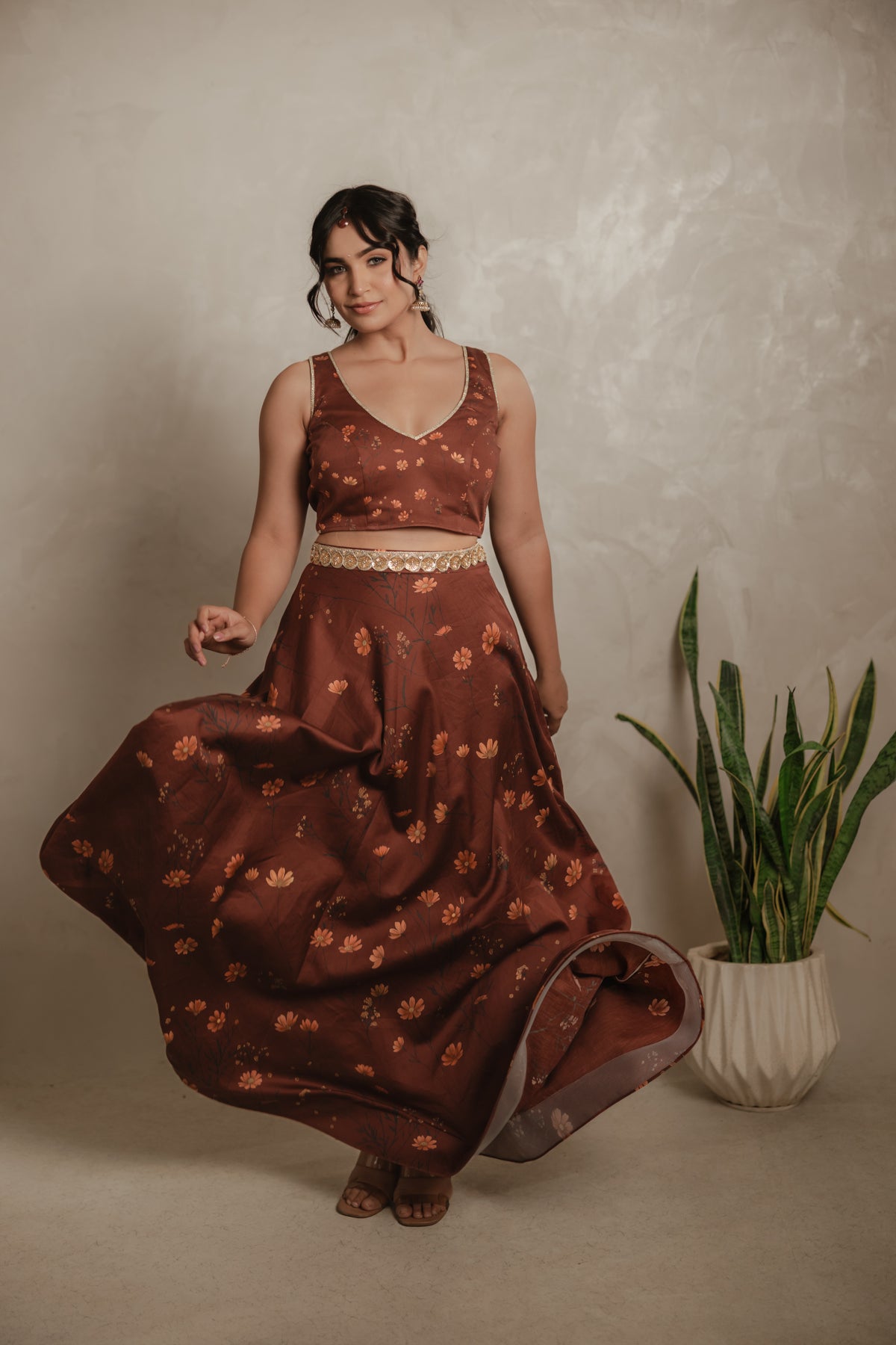 Sthira Celosia co-ord set in vegan silk, rust-brown botanical print, skirt in movement