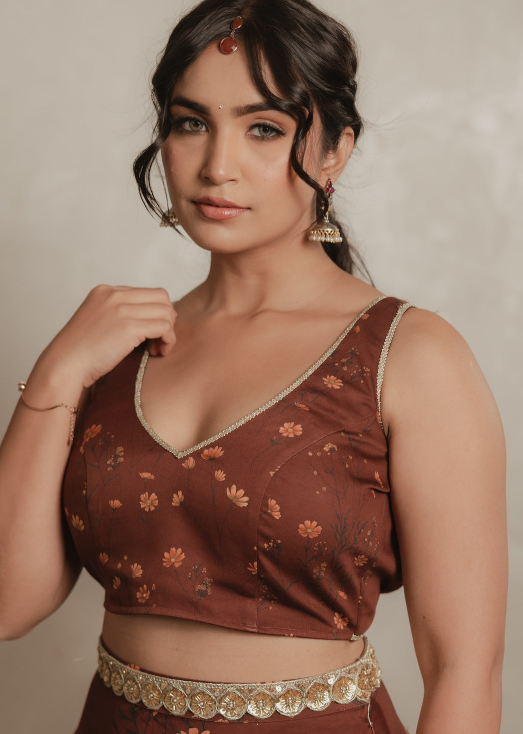 Sthira Celosia sleeveless blouse in deep maroon with botanical print and gold trim