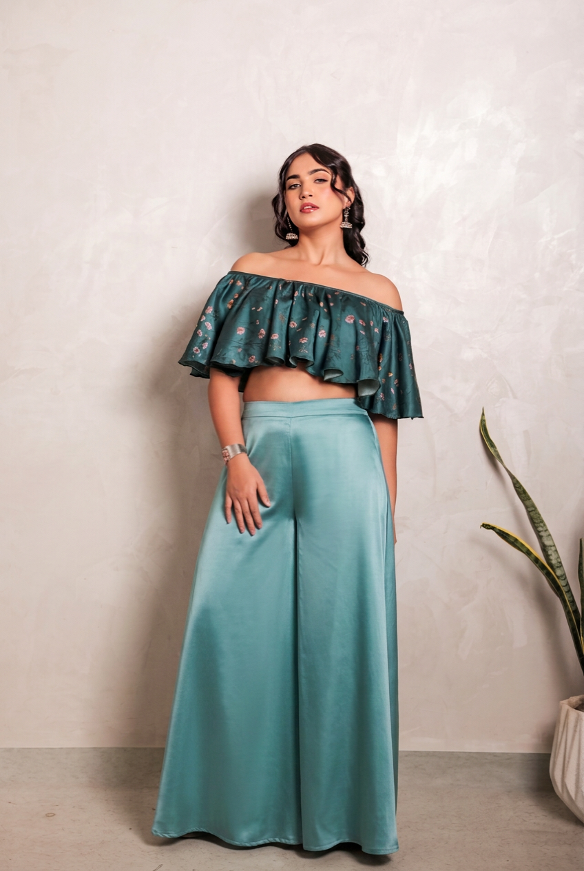 Sthira Bluebell co-ord set in vegan silk, deep teal ruffle blouse and smooth satin trousers, full length, brightened